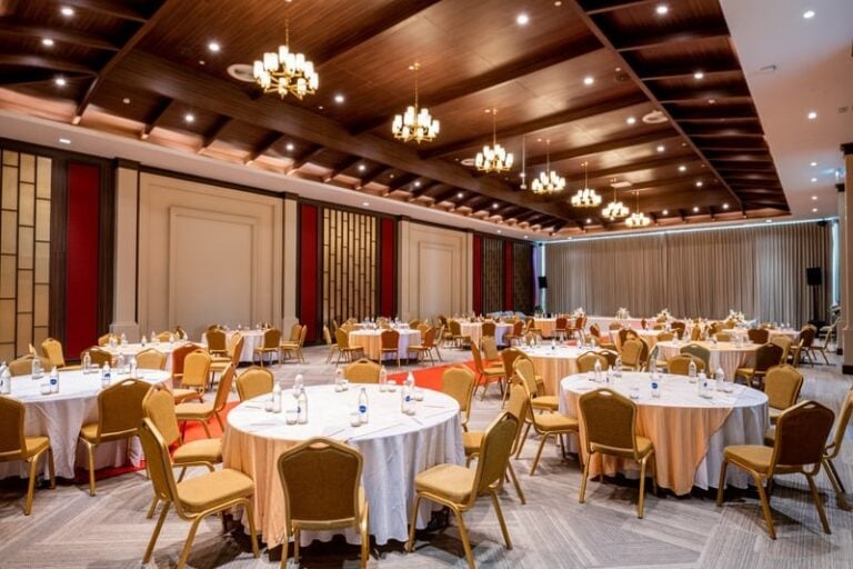 Event Hall with Round Tables and Chandeliers