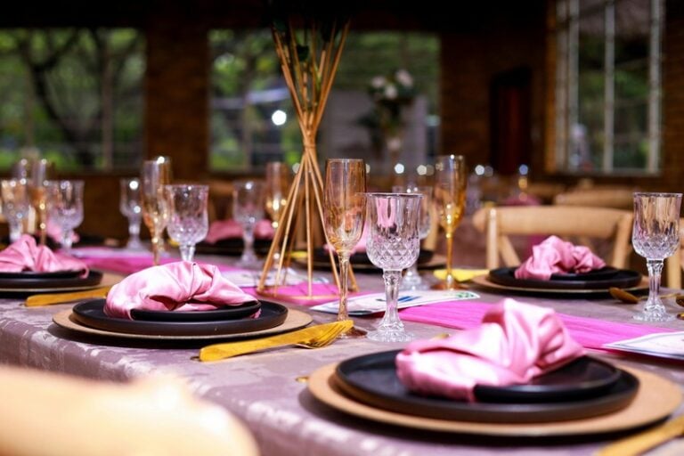 Elegant Table Setting with Pink Decor and Crystal Glasses