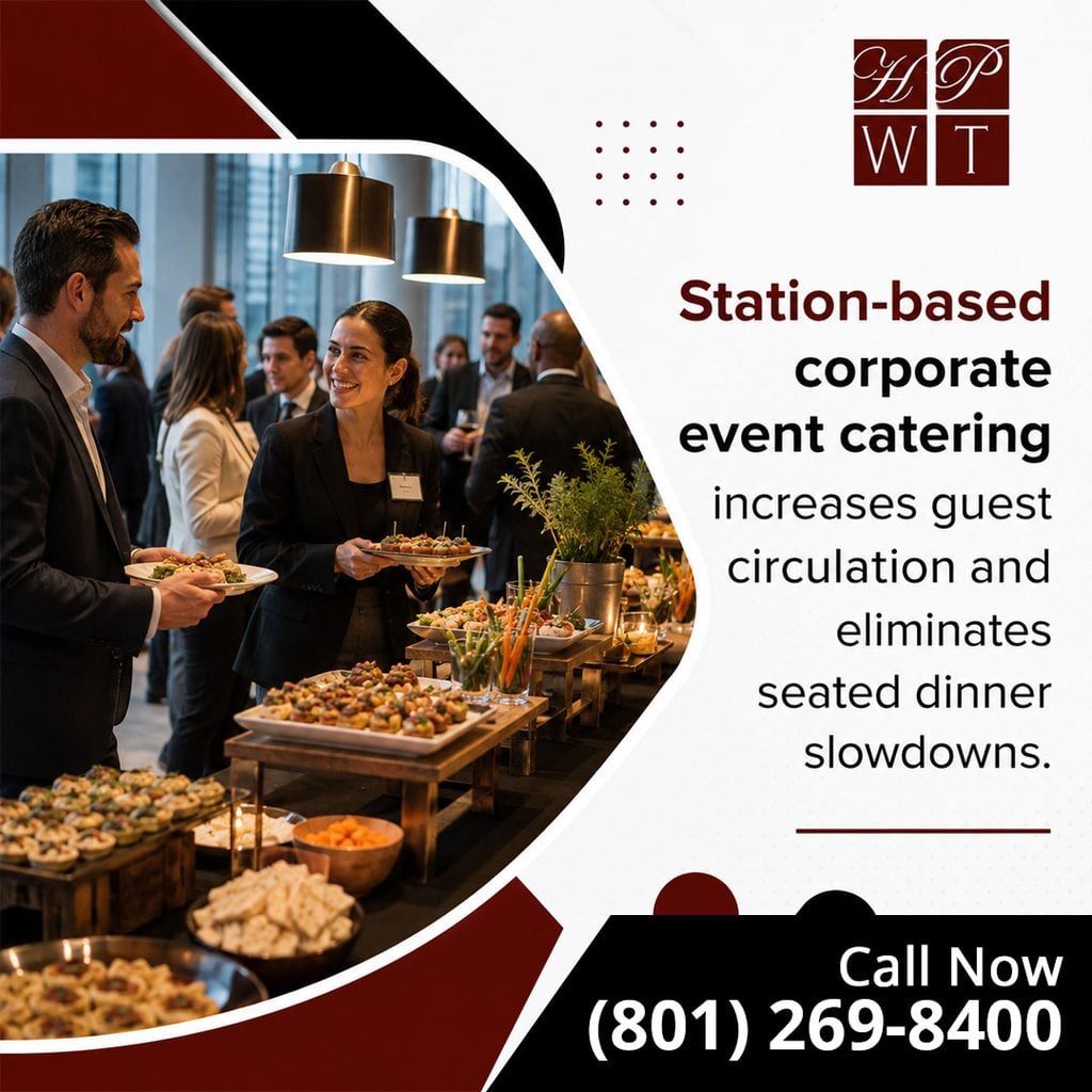 Corporate attendees mingling and serving themselves small bites from an elevated multi-tier appetizer catering station.